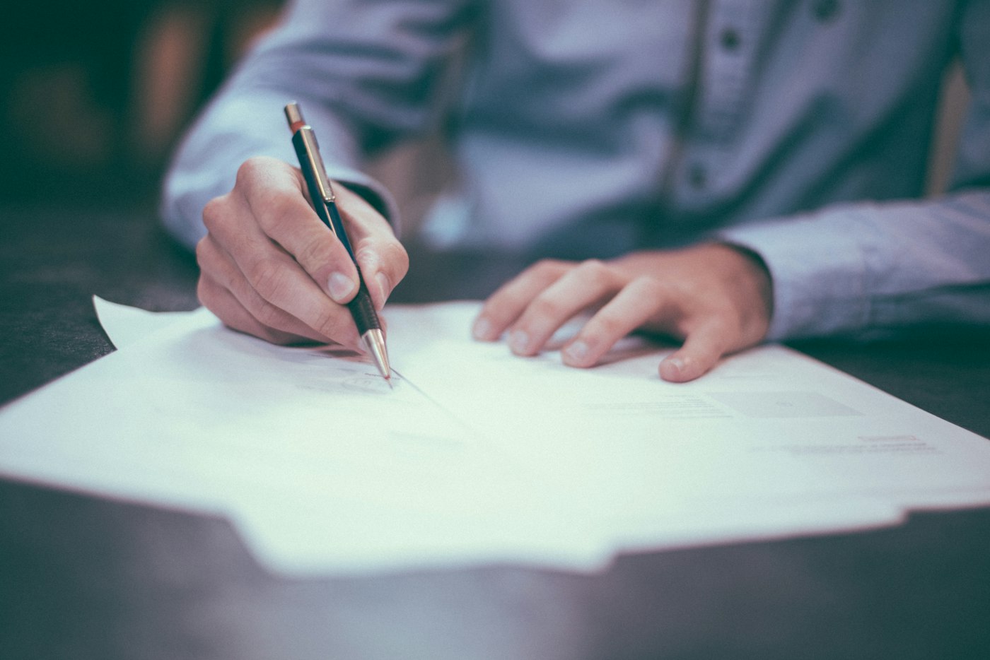 Professional reviewing and signing documents