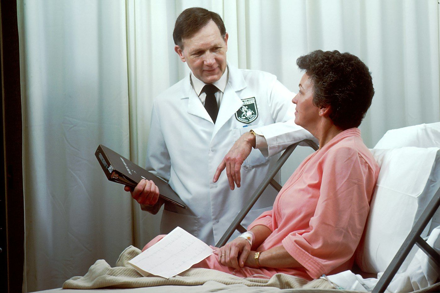 Doctor caring for a patient in a hospital room